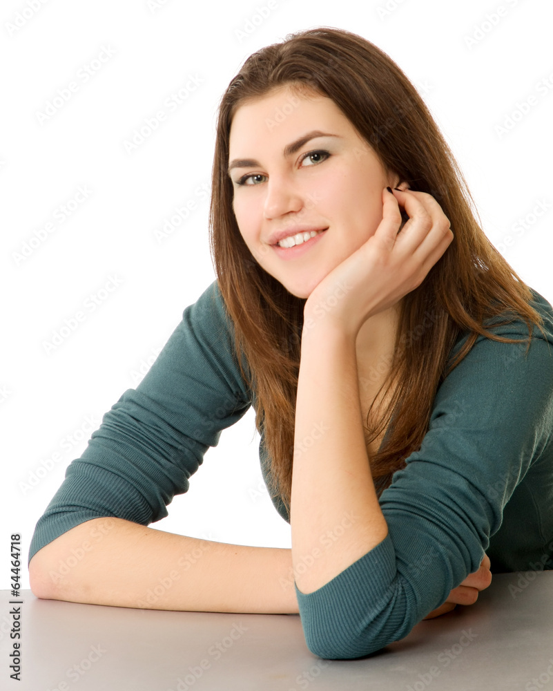 A smiling woman sitting at the desk, isolated on white. A smiling woman sitting at the desk, isolated on white.