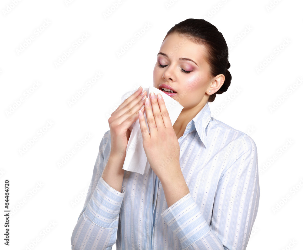 Sick woman blowing her nose, white background. Sick woman blowing her nose, white background.