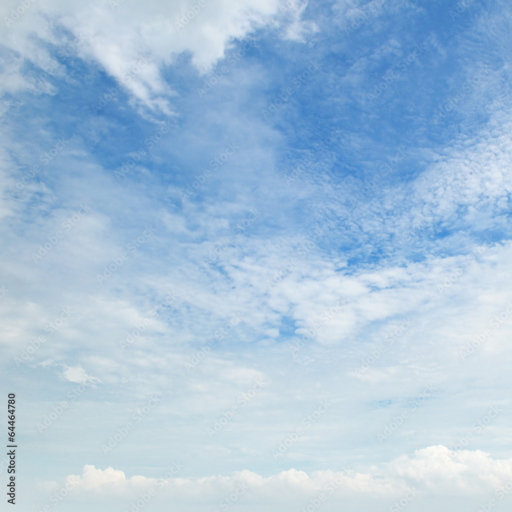 The white cumulus clouds against the blue sky