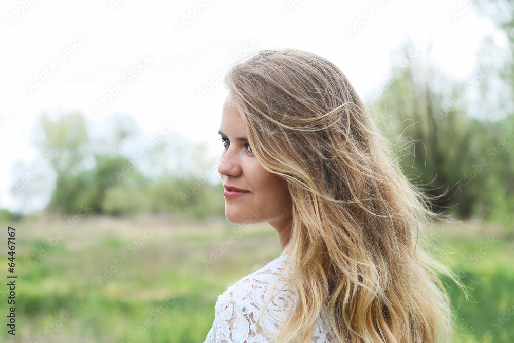 blond cute girl with beautiful wild hair enjoys the freshness blond cute girl with beautiful wild hair enjoys the freshness