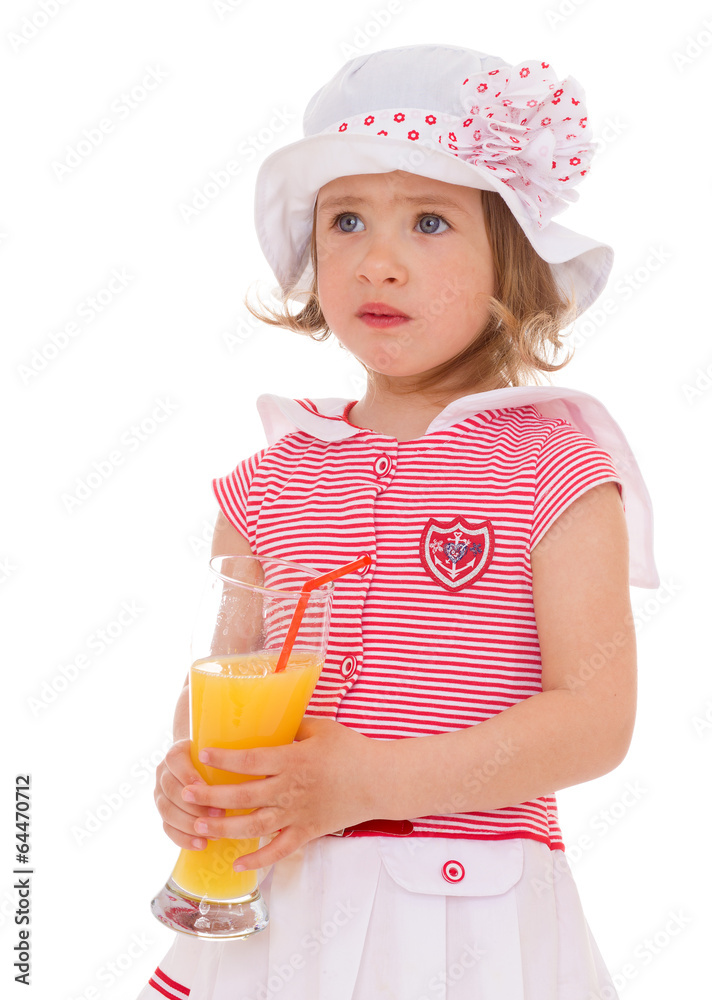 charming little girl with a glass of juice. charming little girl with a glass of juice.