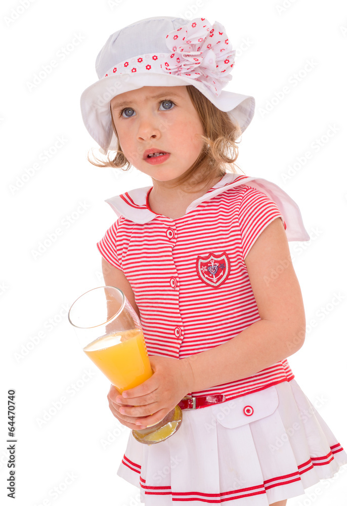 charming little girl with a glass of juice. charming little girl with a glass of juice.