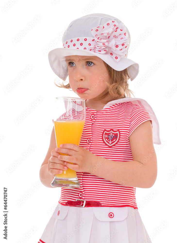 charming little girl with a glass of juice. charming little girl with a glass of juice.