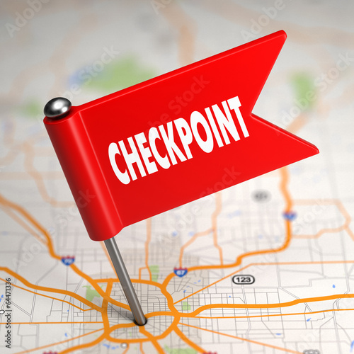 Checkpoint - Small Flag on a Map Background. photo