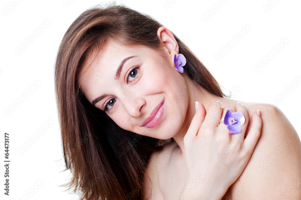 Portrait of beautiful girl with violet flower bijouterie Portrait of beautiful girl with violet flower bijouterie