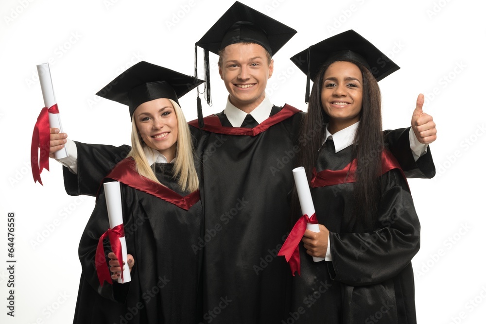 Multi ethnic group of graduated young students isolated on white Multi ethnic group of graduated young students isolated on white