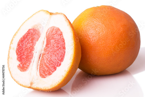 sliced ripe grapefruit on a white background