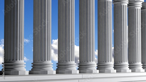 Ancient marble pillars in a row with blue sky