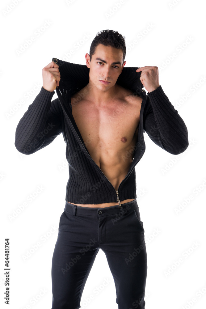 Confident young man with open sweater on muscular torso