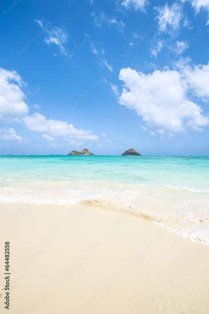 tropical Lanikai beach in Oahu Hawaii with two islands