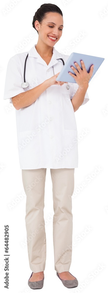 Pretty brown haired nurse using tablet pc