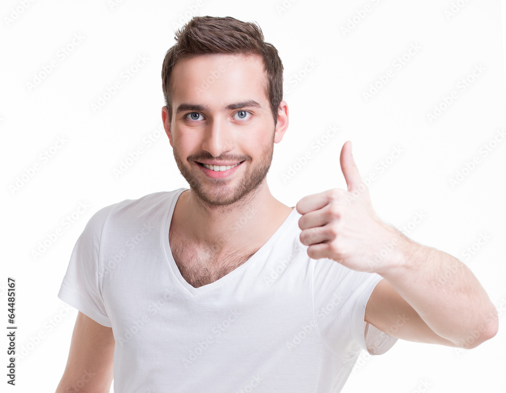 Young happy man with thumbs up sign in casuals. Young happy man with thumbs up sign in casuals.