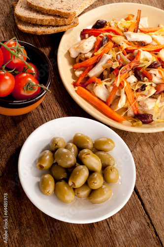 Dish with meat, tomato, cheese and olives