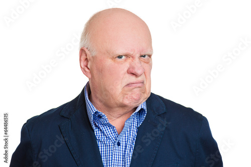 Fotografía Headshot annoyed grumpy suspicious old man white background