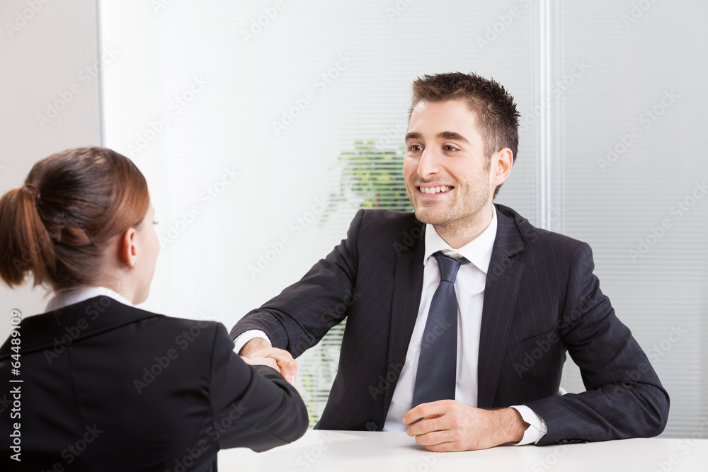 Business people having job interview with young woman. Business people having job interview with young woman.