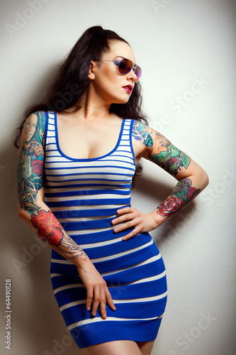 sexy glamorous girl with tattoos..