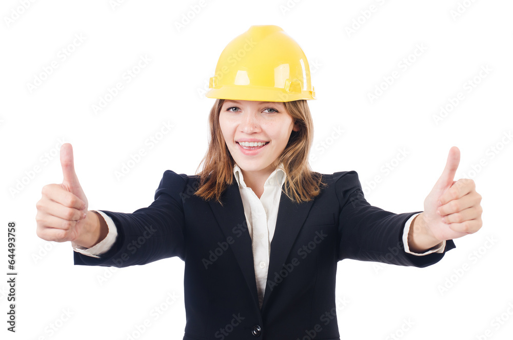 Pretty businesswoman with hard hat thumbing up isolated on whi Pretty businesswoman with hard hat thumbing up isolated on whi