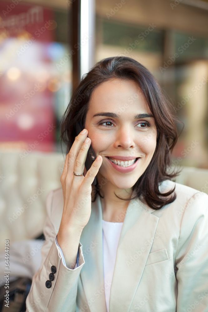 Closeup of a mid adult woman on the phone. Closeup of a mid adult woman on the phone.