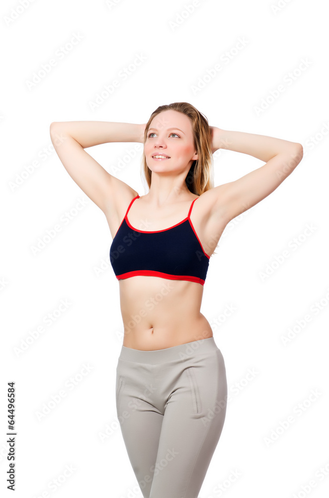 Young female doing exercises on white