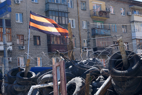 separatist flag over the barricades in Lugansk photo