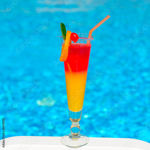 cocktail over blue water background photo