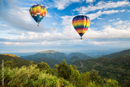 Fotografija Hot air balloon over the mountain