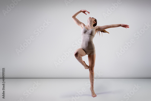 Fototapeta Naklejka Na Ścianę i Meble -  young beautiful dancer teen girl dancing and jumping, studio ser