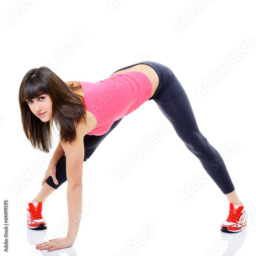 portrait of sport girl doing stretching yoga exercise, studio sh