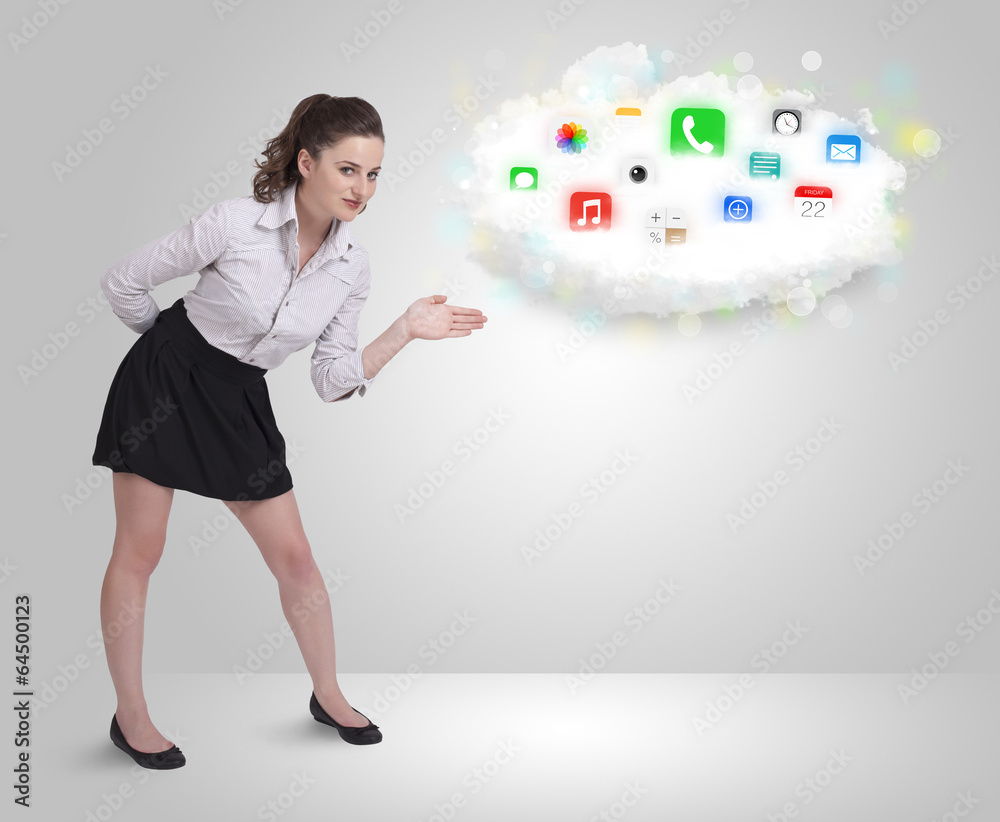 Fototapeta premium Young woman presenting cloud with colorful app icons and symbols