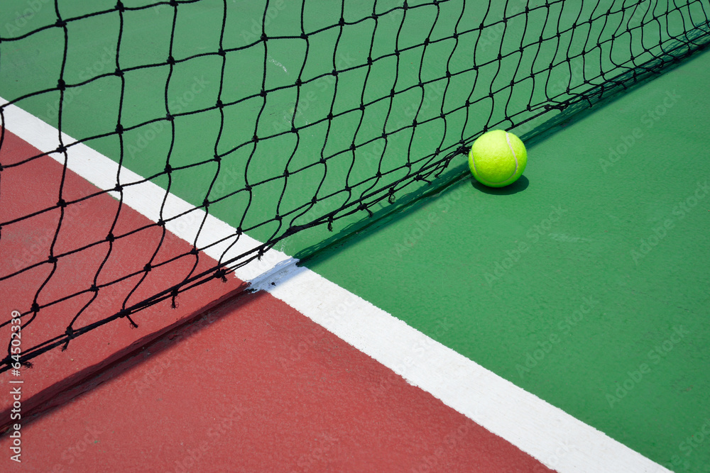 tennis ball on green court