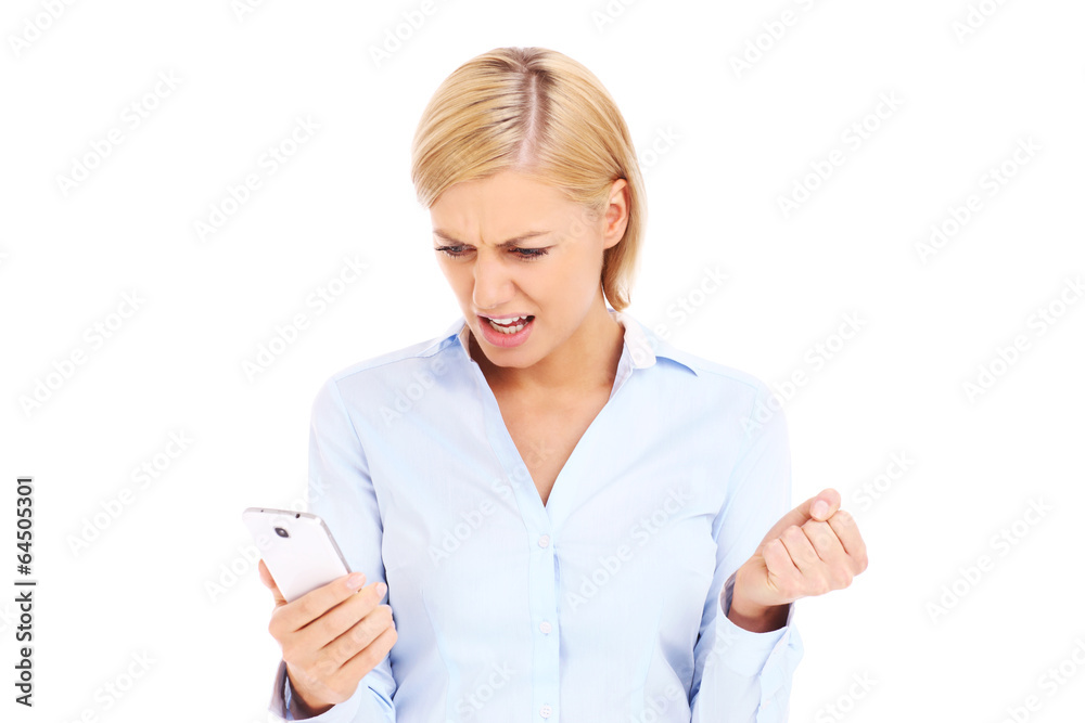 Angry businesswoman with a cellphone Angry businesswoman with a cellphone