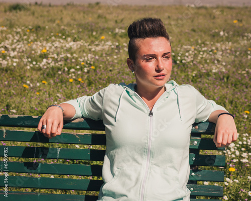 Canvastavla Portrait of a short hair girl sitting on bench