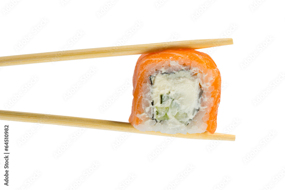 Isolated sushi roll in chopsticks. Macro. Isolated sushi roll in chopsticks. Macro.