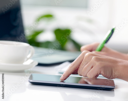 Woman hands with tablet PC and notepad at office © SJ Travel Footage