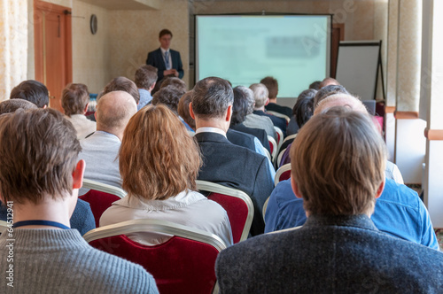 people sitting rear at the business conference