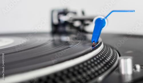 DJ needle on a vinyl record photo