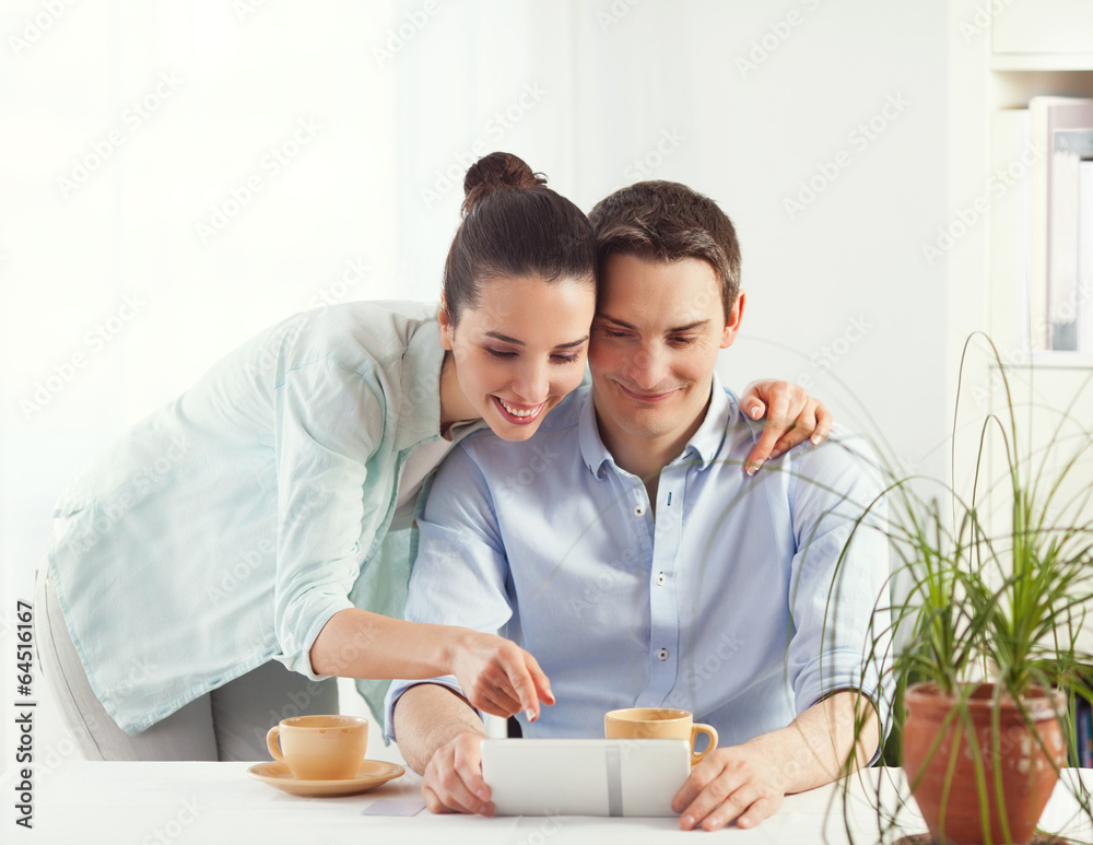 Portrait of happy couple shopping online using digital tablet Portrait of happy couple shopping online using digital tablet