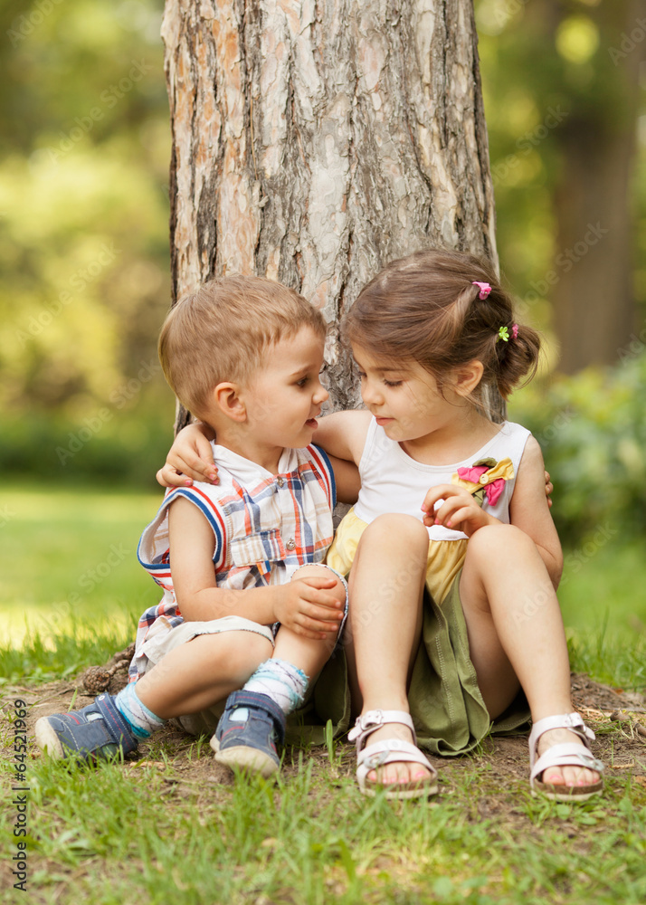 Little brother and sister expressing affection Little brother and sister expressing affection