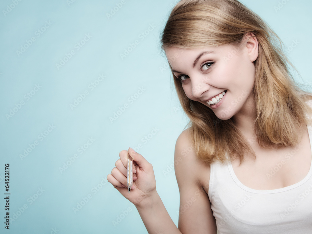 Flu. Sick girl checking thermometer. Health.