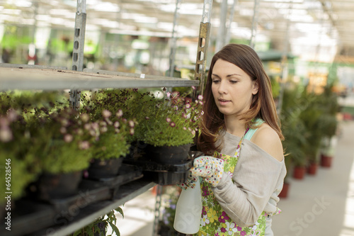 Young woman in flower garden