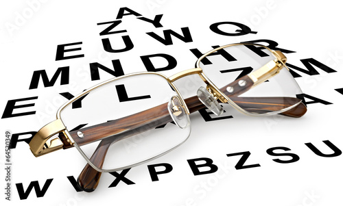Fototapeta Naklejka Na Ścianę i Meble -  Reading glasses with eye chart