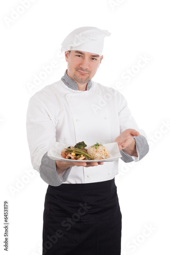 Chef showing and holding a plate of prepared food