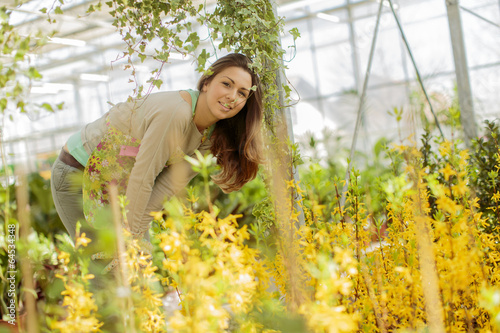 Young woman in flower garden