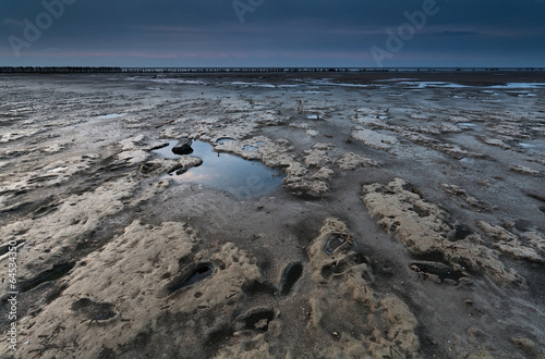 mud on coast during low tide in Nirth sea photo