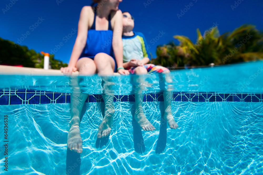 Mother and son by the pool
