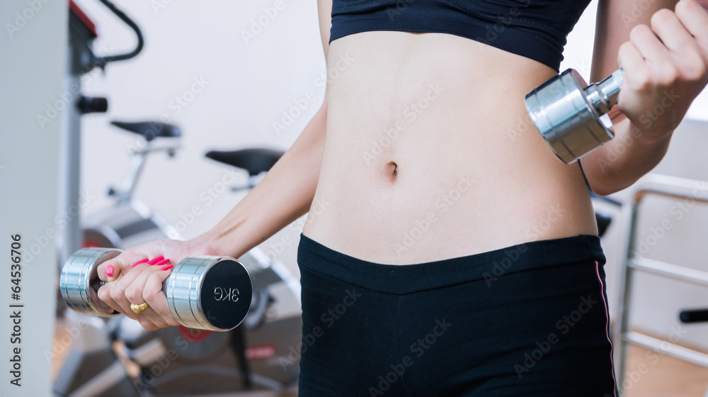 young fit woman lifting dumbbells young fit woman lifting dumbbells