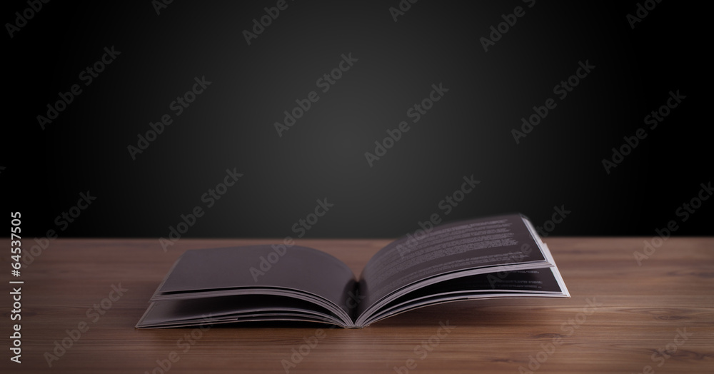 Open book on wooden deck Open book on wooden deck