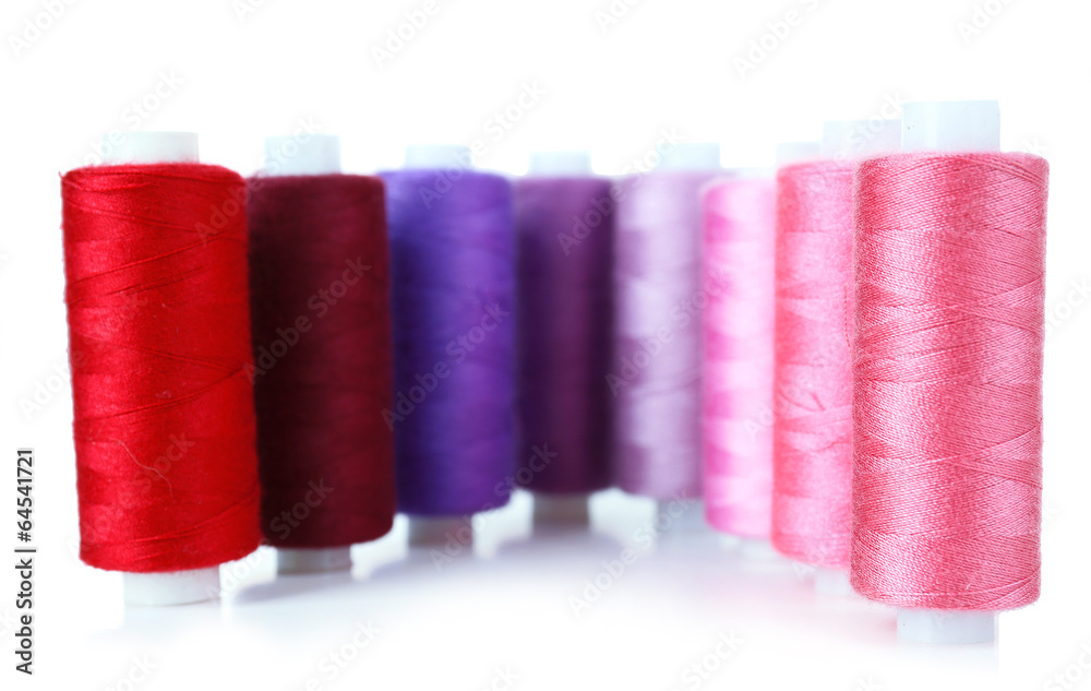 Colored spools of threads isolated on white Colored spools of threads isolated on white