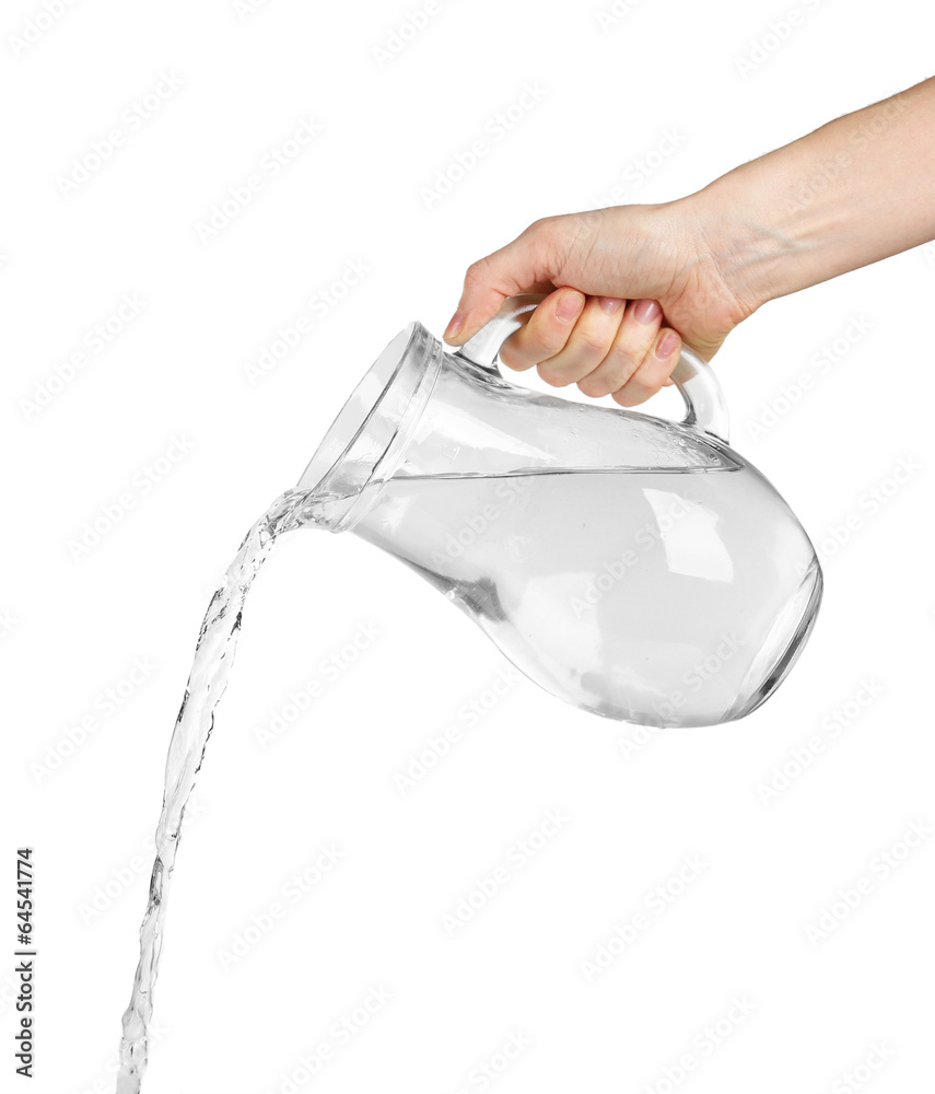Pouring water from glass pitcher, isolated on white Stock Photo