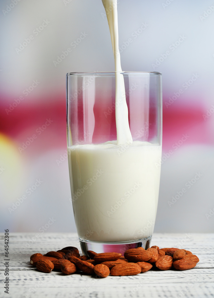 Almond milk is poured into glass, Almond milk is poured into glass,